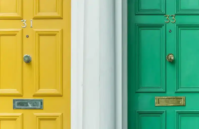 Yellow door beside a green door