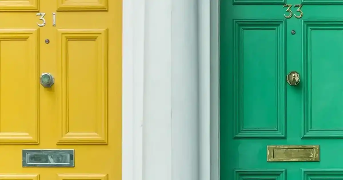 Yellow door beside a green door